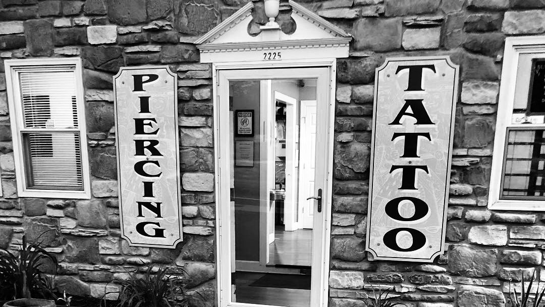 Queen of Hearts Tattoos & Body Piercing
